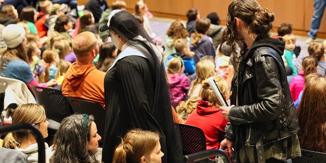 Drag queen activists on Friday in Fayetteville, Arkansas, blocked the views of some parents and children who had turned out for Kirk Cameron's kids' story hour at the public library there.