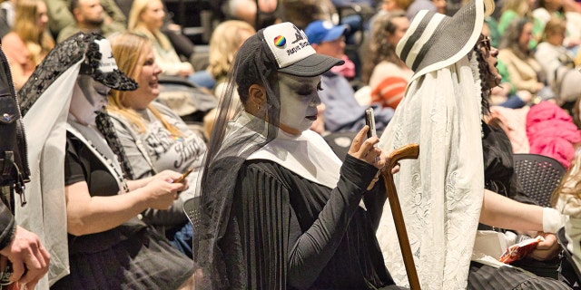 At Kirk Cameron's children's book reading event at the public library in Fayetteville, Arkansas, on Friday, March 17, some individuals dressed in black and white are shown seated with the crowd of about 500 parents and kids. 