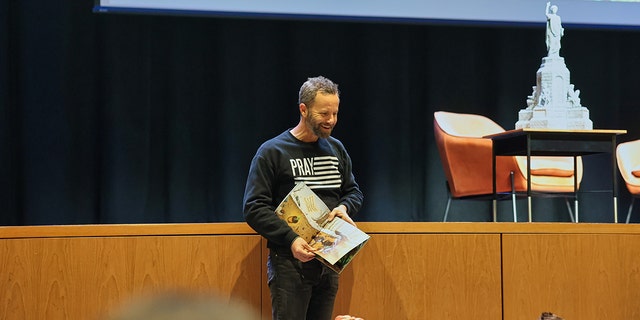 Actor and writer Kirk Cameron reads to the families and children who came out to hear him speak in Fayetteville, Arkansas, on Friday, March 17. 