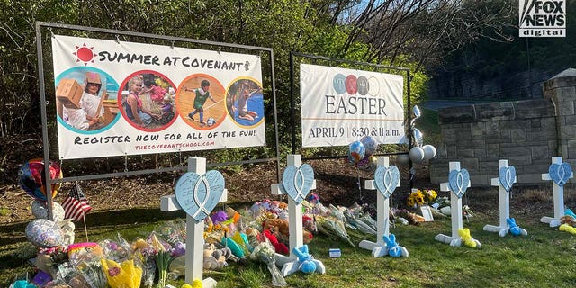 Memorials for the six victims who were killed in a mass shooting are placed outside of The Covenant School in Nashville, Tennessee, on Tuesday, March 28, 2023. Three adults and three children were killed inside the school.