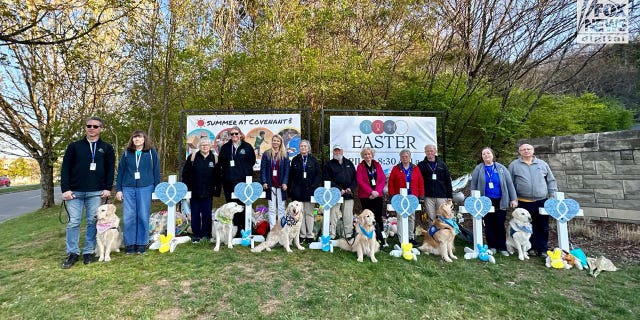 The Lutheran Church Charity's K-9 Crisis Response Team comforts mourners outside The Covenant School in Nashville, Tennessee on Tuesday, March 28, 2023.