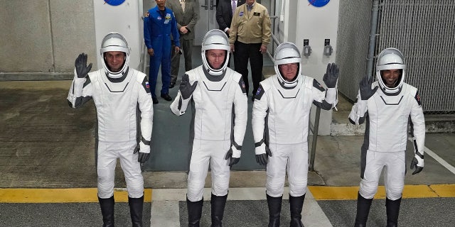 From left, Russian cosmonaut Andrei Fedyaev, NASA astronauts Warren Hoburg, Stephen Bowen, and United Arab Emirates astronaut Sultan al-Neyadi pose for a photo after leaving the Operations and Checkout building for a trip to Launch Pad 39-A Wednesday, March 1, 2023, at the Kennedy Space Center in Cape Canaveral, Fla.