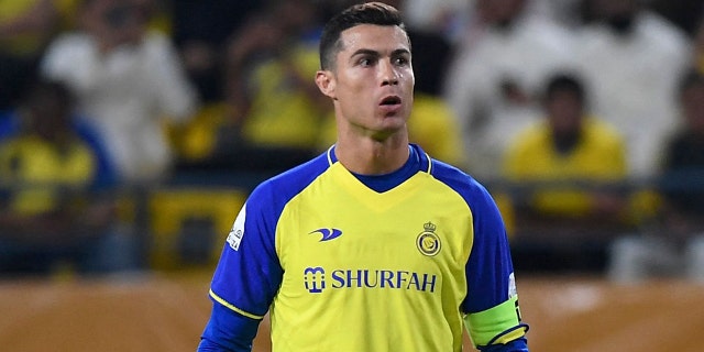 Portuguese Cristiano Ronaldo, Al-Nasr striker, stands in front of a free kick during the Saudi Professional Football League match between Al-Nasr and Al-Batin at Marsool Park Stadium in the Saudi capital, Riyadh, on March 3, 2023.