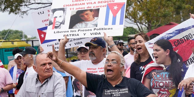 Cuban Americans protest the Cuba national baseball team playing at the World Baseball Classic game, Sunday, March 19, 2023, in Miami. Cuba faces U.S. in a semifinal game.