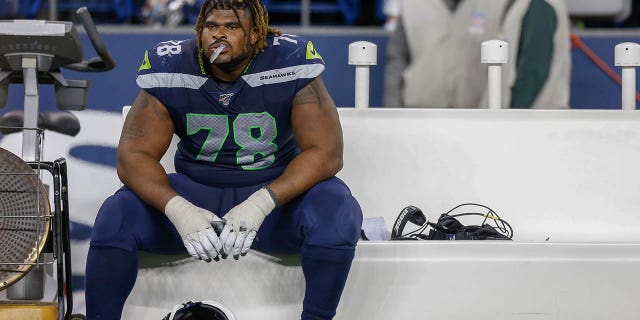 Offensive tackle DJ Fluker, #78 of the Seattle Seahawks, sits on the bench after losing to the San Francisco 49ers 26-21 at CenturyLink Field on December 29, 2019 in Seattle.