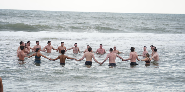 Hof said facing the cold as a group triggers pre-historic togetherness, as demonstrated by cold plunge group Sunday Swim on Long Island, New York.