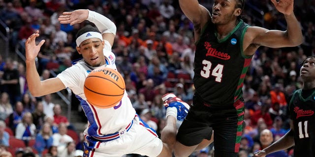 Kansas guard Dajuan Harris Jr. loses the ball out of bounds in front of Howard guard Bryce Harris, #34, in the second half of a first-round college basketball game in the NCAA Tournament, Thursday, March 16, 2023, in Des Moines, Iowa.