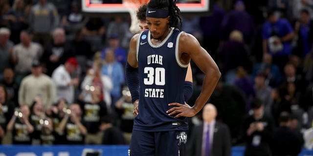 Dan Akin #30 of the Utah State Aggies reacts after losing to Missouri Tigers in the first round of the NCAA Men's Basketball Tournament at Golden 1 Center on March 16, 2023 in Sacramento, California.