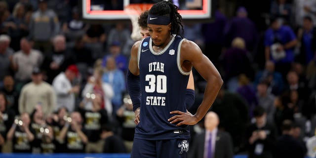 Dan Akin #30 of the Utah State Aggies reacts after losing to Missouri Tigers in the first round of the NCAA Men's Basketball Tournament at Golden 1 Center on March 16, 2023 in Sacramento, California.
