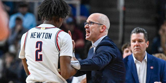 UConn guard Tristen Newton (2) listens to coach Dan Hurley during the first half of the team's second-round college basketball game against Saint Mary's in the men's NCAA Tournament on Sunday, March 19, 2023, in Albany, N.Y. 