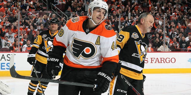 Danny Briere, number 48 of the Philadelphia Flyers alumni, reacts after his second period goal against Bryan Trottier, number 19 of the Pittsburgh Penguins alumni, on January 14, 2017 at the Wells Fargo Center in Philadelphia.