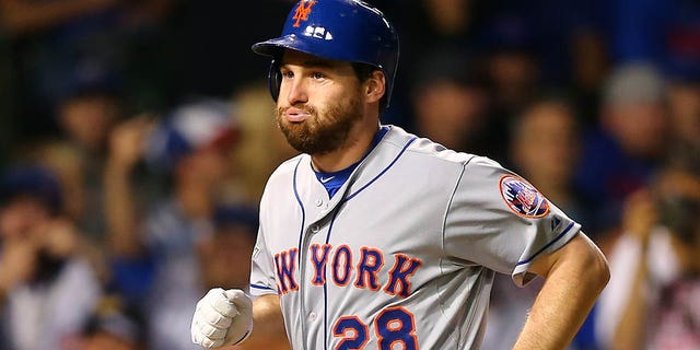 Daniel Murphy, #28 of the New York Mets, celebrates after hitting a two-run home run in the eighth inning against Fernando Rodney, #57 of the Chicago Cubs, during Game 4 of the National League Championship Series of the 2015 MLB at Wrigley Field on October 21, 2015 in Chicago.