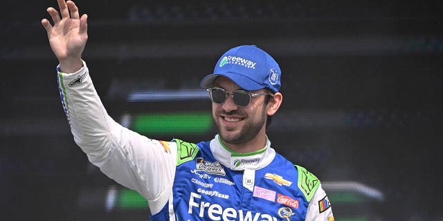 Daniel Suarez waves to fans during driver intros prior to the NASCAR Cup Series EchoPark Automotive Grand Prix on March 26, 2023 in Austin.
