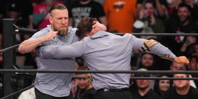 AEW Champion Maxwell Jacob Friedman, right, and Bryan Danielson do so during AEW Dynamite at the Footprint Center in Phoenix on February 22, 2023.