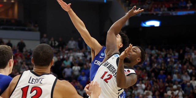Ryan Nembhard #2 of the Creighton Bluejays fouls Darrion Trammell #12 of the San Diego State Aztecs during the second half in the Elite Eight round of the NCAA Men's Basketball Tournament at KFC YUM! Center on March 26, 2023 in Louisville, Kentucky.