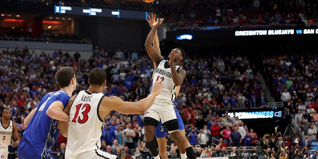 Ryan Nembhard #2 of the Creighton Bluejays fouls Darrion Trammell #12 of the San Diego State Aztecs during the second half of the Elite Eight round of the NCAA Men's Basketball Tournament at KFC YUM!  Center on March 26, 2023 in Louisville, Kentucky.