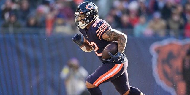 David Montgomery #32 of the Chicago Bears runs with the ball during the second half of the game against the Minnesota Vikings at Soldier Field on January 08, 2023, in Chicago, Illinois.