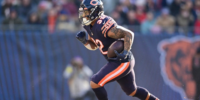 David Montgomery #32 of the Chicago Bears runs with the ball during the second half of the game against the Minnesota Vikings at Soldier Field on January 08, 2023, in Chicago, Illinois.