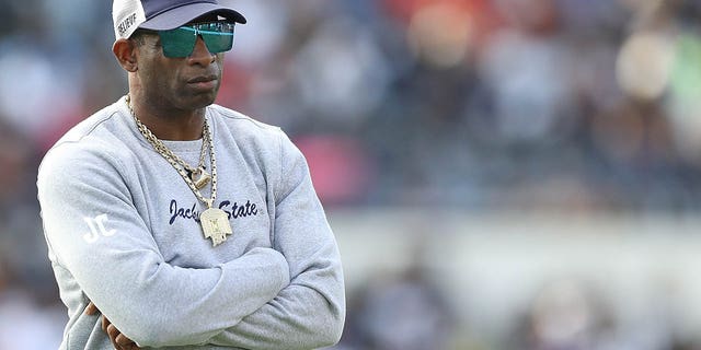 Jackson State Tigers head coach Deion Sanders looks on before the game against the Southern University Jaguars in the SWAC Championship at Mississippi Veterans Memorial Stadium on December 3, 2022 in Jackson, Mississippi.