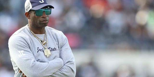 Head coach Deion Sanders of the Jackson State Tigers looks on before the game against the Southern University Jaguars in the SWAC Championship at Mississippi Veterans Memorial Stadium on Dec. 3, 2022 in Jackson, Mississippi.