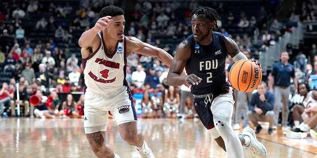 Demetre Roberts #2 of the Fairleigh Dickinson Knights drives to the basket against Bryan Greenlee #4 of the Florida Atlantic Owls during the second half of a second round game of the NCAA Men's Basketball Tournament at Nationwide Arena on March 19, 2023 in Columbus, Ohio.