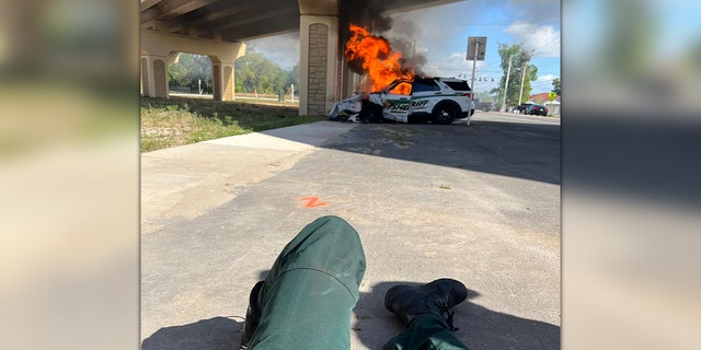 Orlando fire Lt. Ben Wootson pulls a Seminole County Sheriff's Office deputy from a burning patrol vehicle.