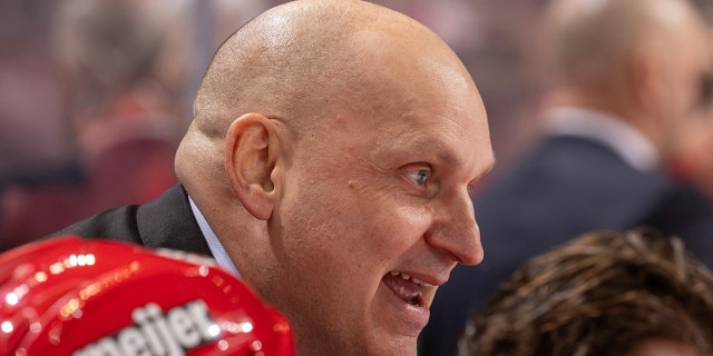 Detroit Red Wings head coach Derek Lalonde talks to the referee on a play stoppage during the second period of an NHL game against the San Jose Sharks at Little Caesars Arena on Jan. 24, 2023 in Detroit.