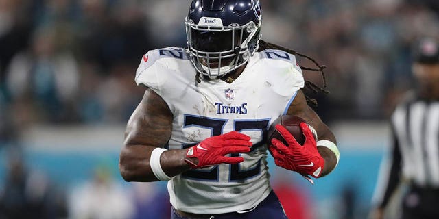 Derrick Henry #22 of the Tennessee Titans carries the ball during the first half against the Jacksonville Jaguars at TIAA Bank Field on January 07, 2023 in Jacksonville, Florida.