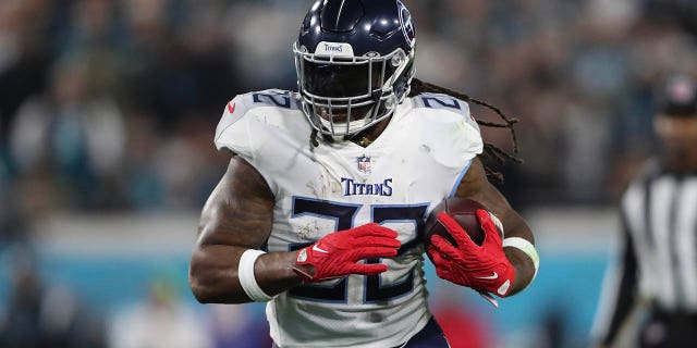 Derrick Henry #22 of the Tennessee Titans carries the ball during the first half against the Jacksonville Jaguars at TIAA Bank Field on January 07, 2023 in Jacksonville, Florida.