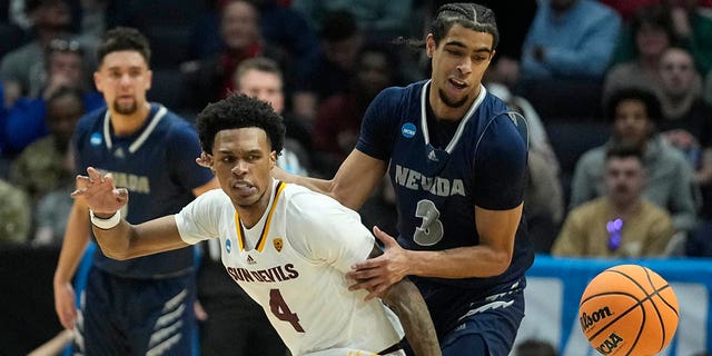 Arizona State's Desmond Cambridge Jr. (4) and Nevada's Trey Pettigrew (3) go for a loose ball during the first half of a First Four college basketball game in the NCAA men's basketball tournament, Wednesday, March 15, 2023, in Dayton, Ohio. 