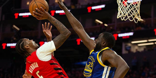 Portland Trail Blazers forward Cam Reddish (5) shoots over Golden State Warriors forward Draymond Green (23) during the second quarter at Chase Center in San Francisco Feb. 28, 2023.