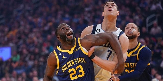Golden State Warriors forward Draymond Green (23) battles for position against Dallas Mavericks center Dwight Powell (7) in the first quarter at the Chase Center in San Francisco on February 4, 2023.