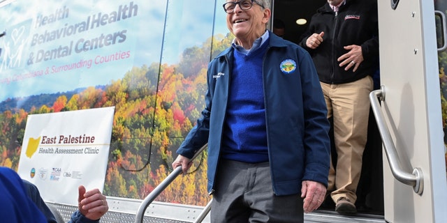 Ohio Governor Mike DeWine exits a newly opened mobile clinic following the derailment of a train carrying toxic chemicals which caused a fire that sent a cloud of smoke over the town of East Palestine, Ohio, Feb. 21, 2023. 