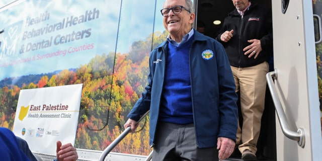 Ohio Governor Mike DeWine exits a newly opened mobile clinic following the derailment of a train carrying toxic chemicals which caused a fire that sent a cloud of smoke over the town of East Palestine, Ohio, Feb. 21, 2023.