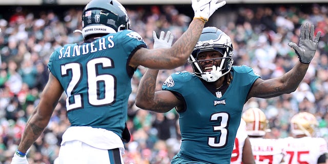 Philadelphia Eagles' Miles Sanders (26) celebrates with Zach Pascal (3) after scoring a 6-yard touchdown run against the San Francisco 49ers during the first quarter of the NFC Championship game at Lincoln Financial Field on January 29, 2023 in Philadelphia. 