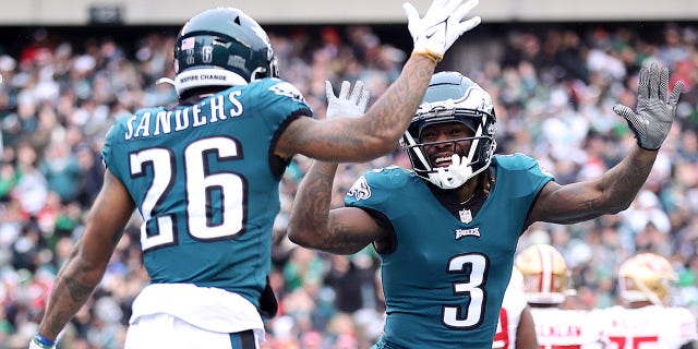 Miles Sanders, #26 of the Philadelphia Eagles, celebrates with Zach Pascal, #3, after scoring a 6-yard touchdown run against the San Francisco 49ers during the first quarter in the NFC Championship Game at Lincoln Financial Field on January 29. January 2023, in Philadelphia, Pennsylvania. 