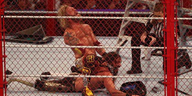 Edge competes with Seth Rollins, bottom, during the World Wrestling Entertainment Crown Jewel pay-per-view in the Saudi capital Riyadh on Oct. 21, 2021.