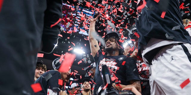 The San Diego State Aztecs celebrate defeating the Creighton Bluejays during the Elite Eight of the 2023 NCAA Tournament at KFC YUM! Center March 26, 2023, in Louisville, Ky.