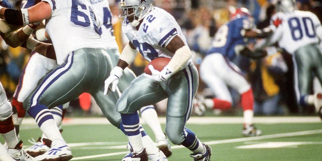 Emmitt Smith, #22 of the Dallas Cowboys, carries the ball against the Buffalo Bills during Super Bowl XXVIII on Jan. 30, 1994 at the Georgia Dome in Atlanta.