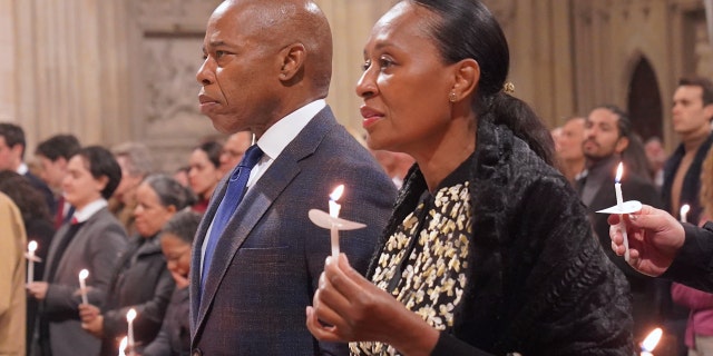 New York City Mayor Eric Adams, Former Mayor of New York City Rudy Giuliani, Rabbi Joseph Potasnik and dozens people attend midnight Christmas midnight mass at St. Patrick's Cathedral in Manhattan, New York, on Dec. 25, 2022. 