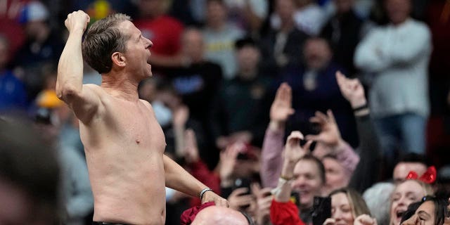 Arkansas head coach Eric Musselman celebrates with fans after beating Kansas in the NCAA Tournament, Saturday, March 18, 2023, in Des Moines, Iowa.