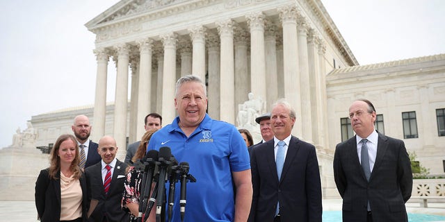 Former Bremerton High School assistant football coach Joe Kennedy answers questions after his legal case, Kennedy v. Bremerton School District, goes before the Supreme Court on April 25, 2022 in Washington, DC.