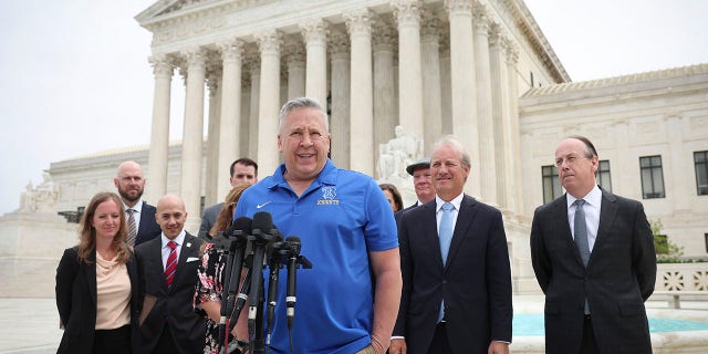 Former Bremerton High School assistant football coach Joe Kennedy answers questions after his legal case, Kennedy v. Bremerton School District, goes before the Supreme Court on April 25, 2022 in Washington, DC.