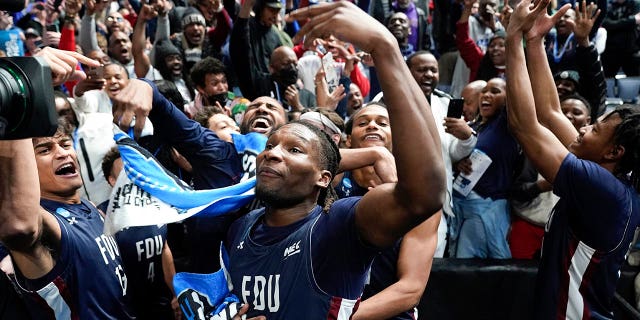 Fairleigh Dickinson players celebrate beating Purdue 63-58 after a first-round college basketball game in the NCAA Tournament on Friday, March 17, 2023, in Columbus, Ohio.