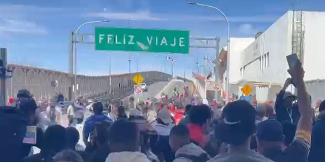 A group of migrants rushed a bridge connecting Mexico to El Paso, Texas on Sunday.