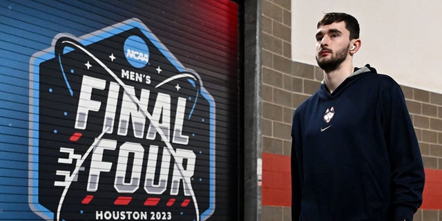 Alex Karaban of the Connecticut Huskies walks during media availability for the Final Four arsenic  portion  of the NCAA Tournament astatine  NRG Stadium March 30, 2023, successful  Houston.
