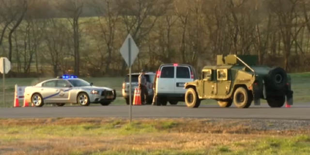 Investigators arrive at the scene of the crash in Trigg County, Kentucky, on Wednesday, March 29.