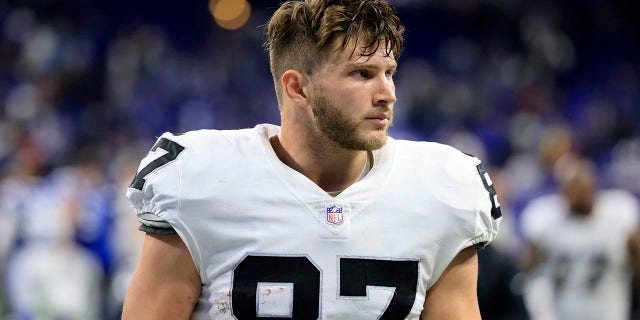 Foster Moreau of the Las Vegas Raiders walks off the field after a win over the Indianapolis Colts at Lucas Oil Stadium Jan. 2, 2022, in Indianapolis.