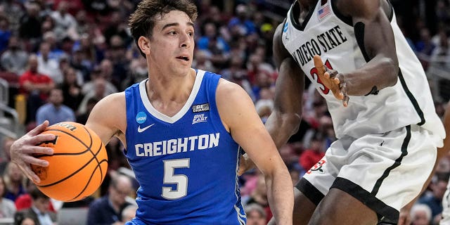 Creighton guard Francisco Farabello (5) pushes against San Diego State forward Nathan Mensah (31) in the first half of an Elite 8 college basketball game in the NCAA South Regional Tournament, Sunday, May 26. March 2023, in Louisville, Ky.