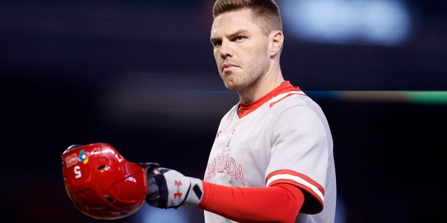 Freddie Freeman of Team Canada removes his helmet after the final out in the second inning of a World Baseball Classic Pool C game against Team Colombia at Chase Field March 14, 2023, in Phoenix, Ariz.